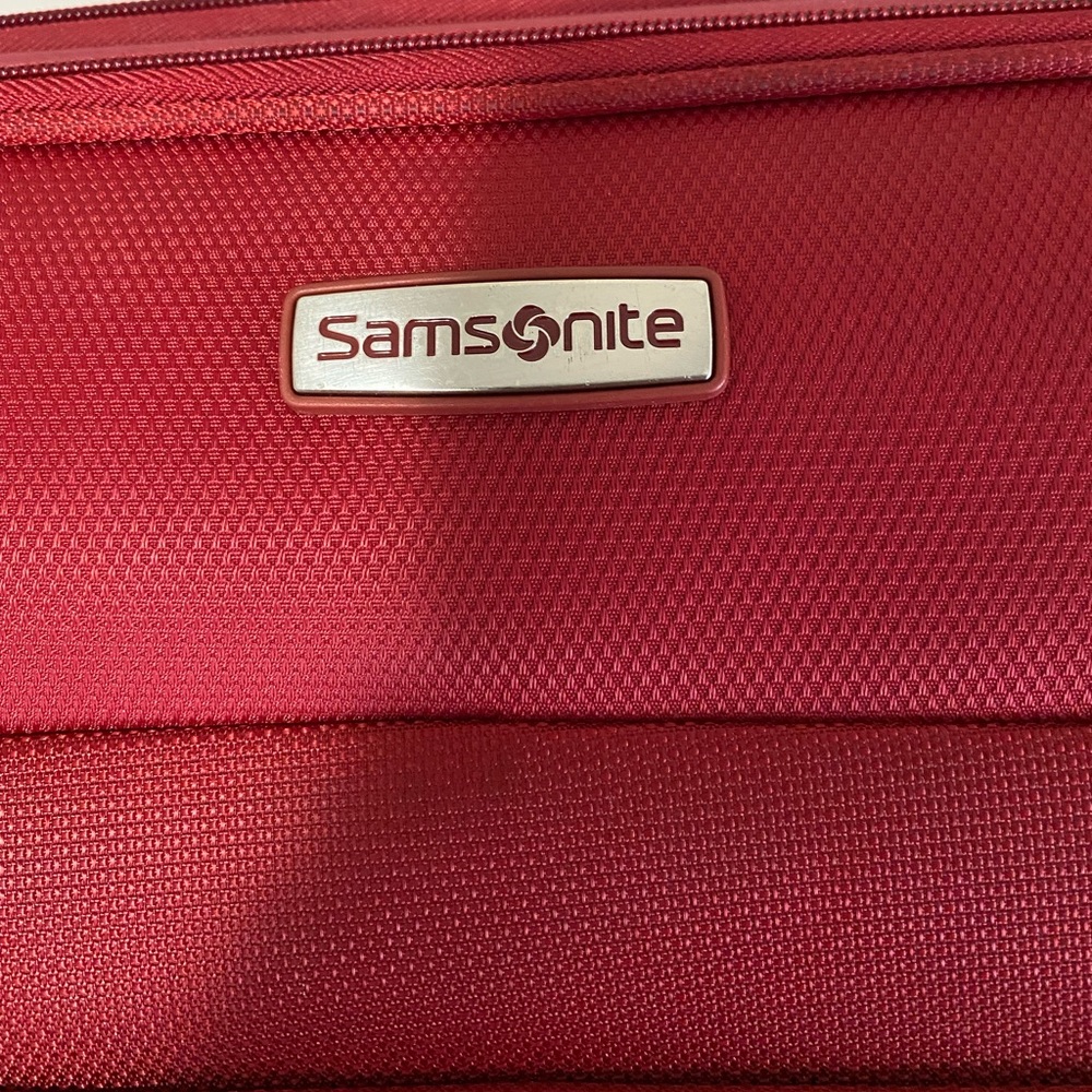Red Samsonite overnighter with wheels